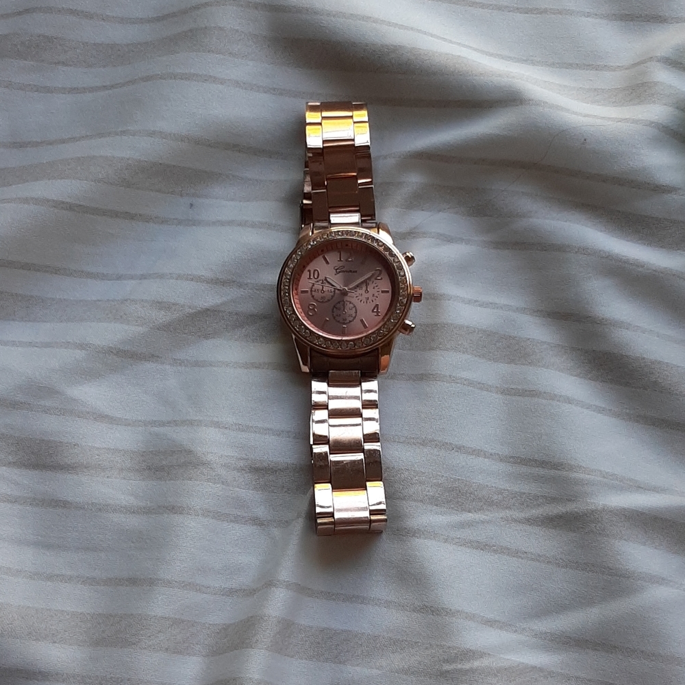 Geneva rose gold watch embezzled